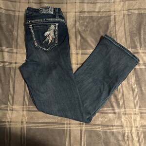 Grace in LA Women's Feather Insert Embellished Pockets Bootcut Stretch Jeans